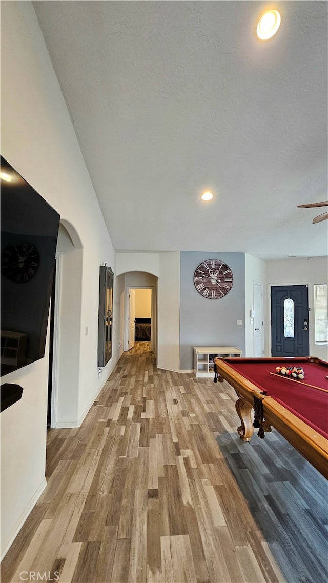 rec room with billiards, hardwood / wood-style flooring, a textured ceiling, and ceiling fan