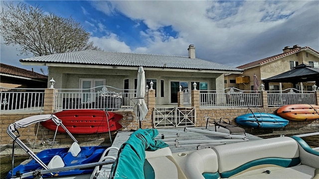 back of house with outdoor lounge area