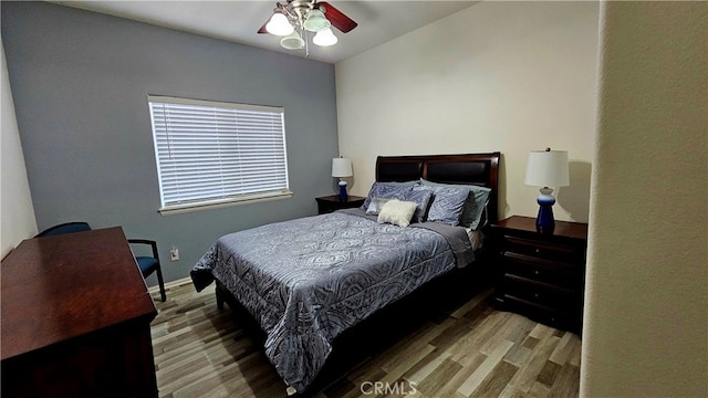 bedroom featuring ceiling fan and hardwood / wood-style floors