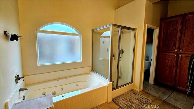 bathroom featuring shower with separate bathtub and tile patterned floors