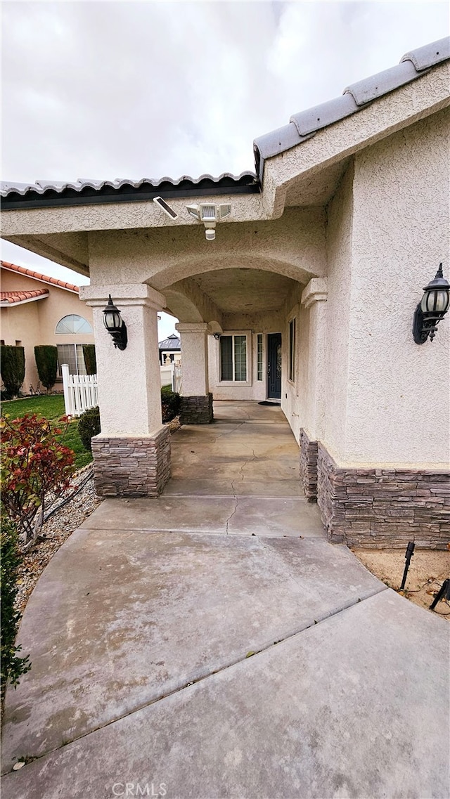 doorway to property featuring a patio area