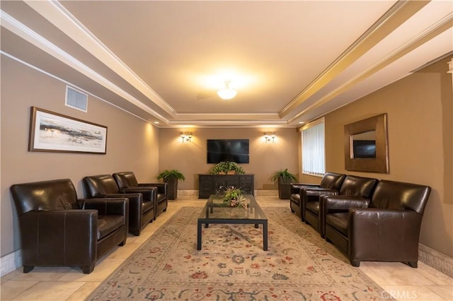 home theater room featuring light tile patterned flooring, a raised ceiling, and crown molding