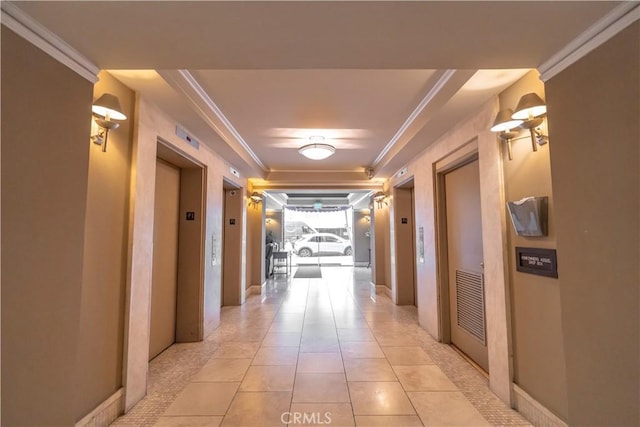 hall featuring light tile patterned floors, elevator, and crown molding