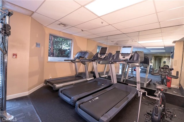 gym featuring a drop ceiling