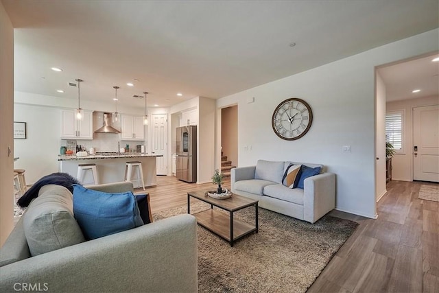 living room with light hardwood / wood-style floors