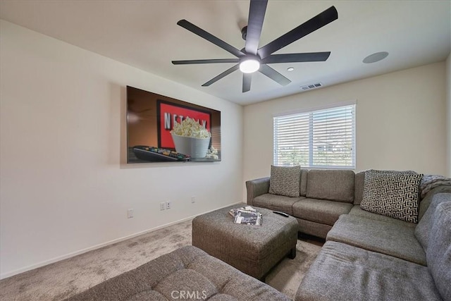 living room featuring carpet flooring and ceiling fan