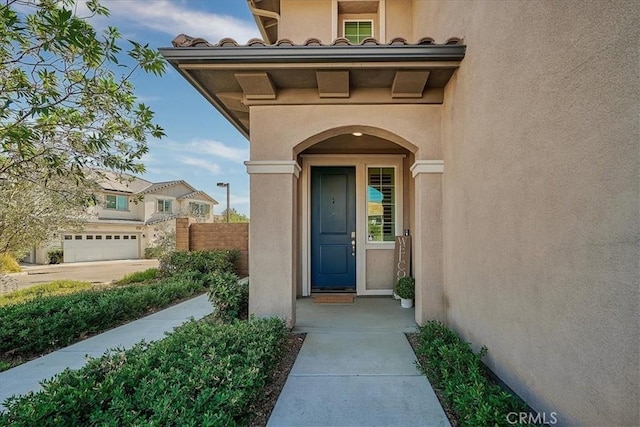 property entrance with a garage