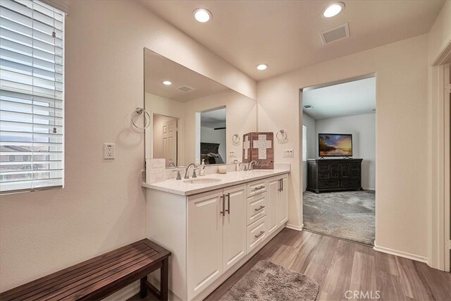 bathroom featuring vanity and hardwood / wood-style flooring