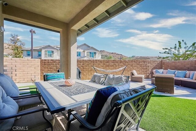 exterior space featuring an outdoor living space and a patio