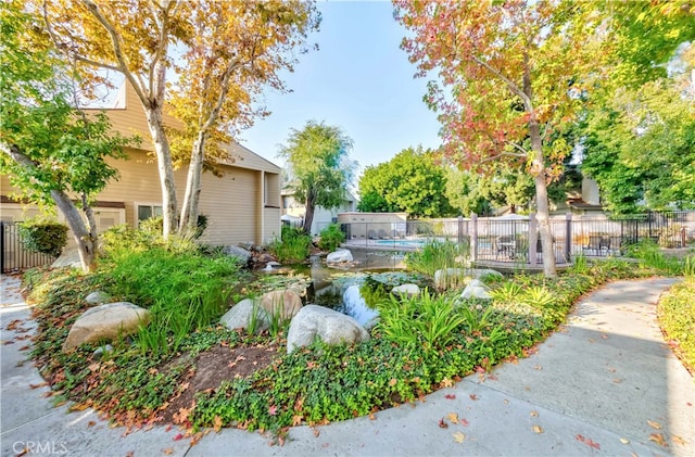 view of yard with a fenced in pool