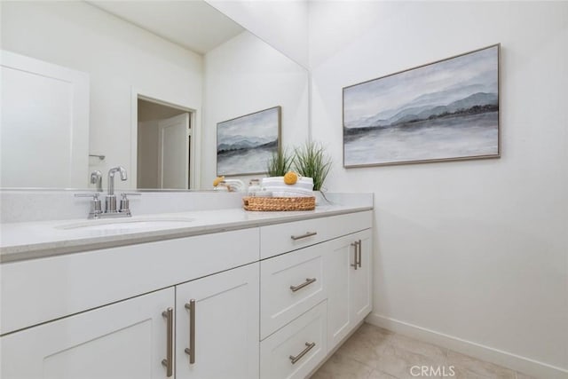 bathroom with tile patterned flooring and vanity