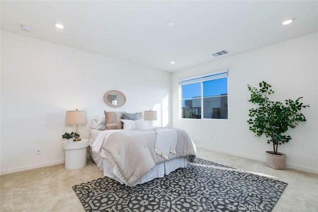 bedroom with light carpet