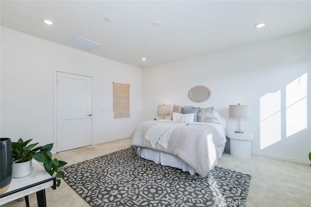 bedroom with light colored carpet