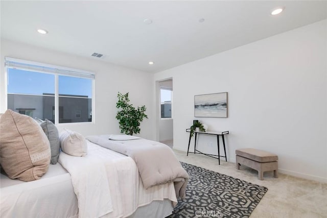 bedroom with light colored carpet