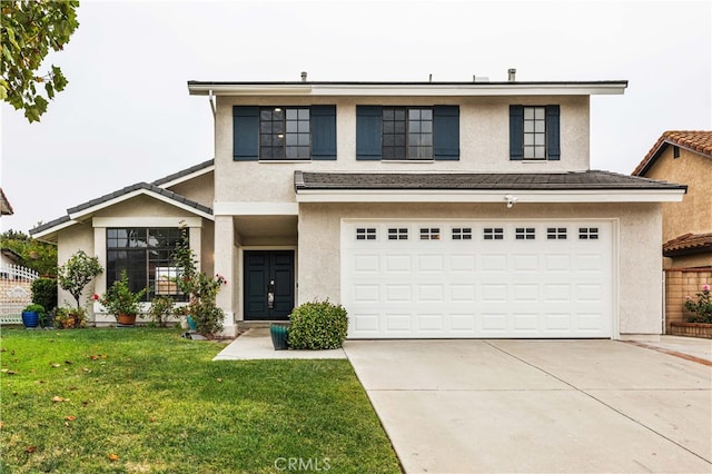 view of front facade featuring a front lawn and a garage