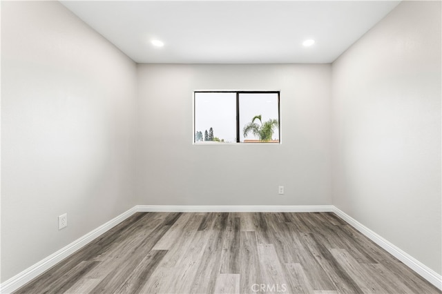 unfurnished room featuring wood-type flooring