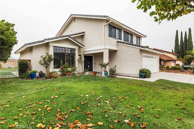 view of front of home featuring a front lawn and a garage