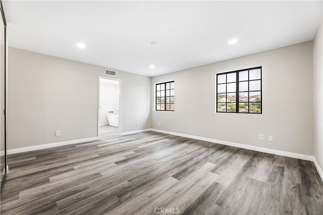 spare room featuring hardwood / wood-style floors