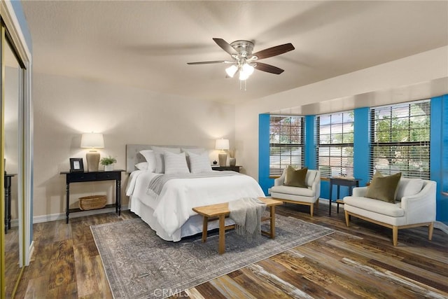 bedroom featuring dark hardwood / wood-style flooring, a closet, and ceiling fan