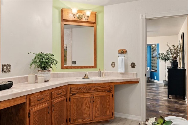 bathroom with wood-type flooring and vanity