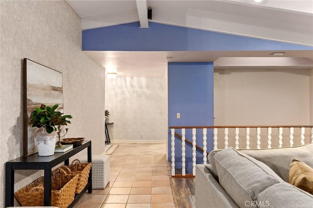 hallway featuring vaulted ceiling with beams and light tile patterned floors