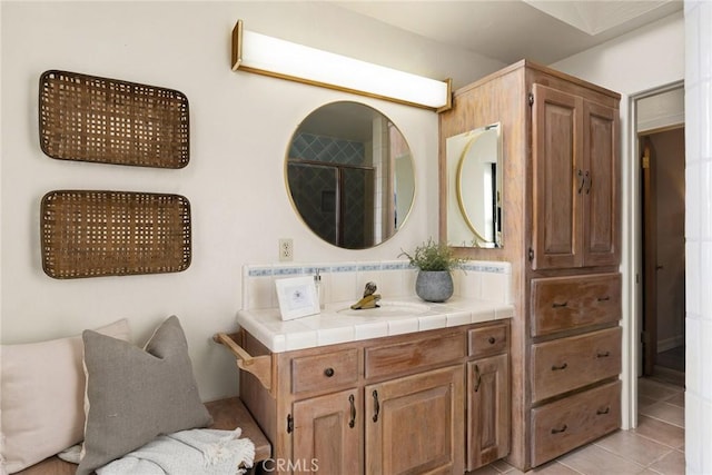 bathroom with tile patterned floors and vanity