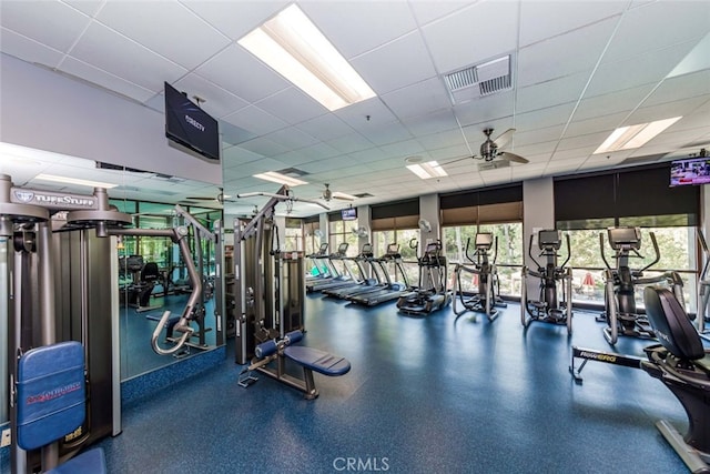 gym featuring a paneled ceiling and ceiling fan