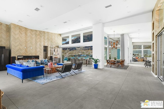 interior space with a high ceiling and concrete flooring