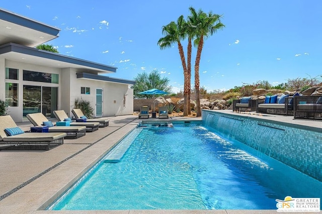 view of swimming pool featuring a patio and pool water feature