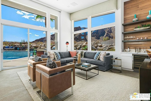 interior space featuring wine cooler and indoor bar