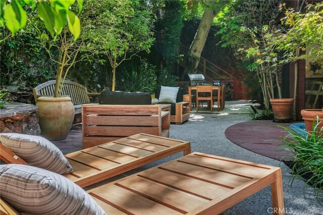 view of patio with an outdoor living space and grilling area