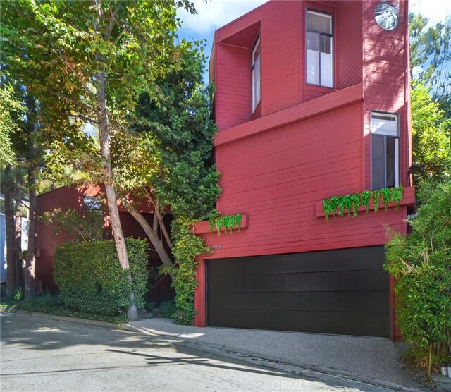 view of side of home with a garage