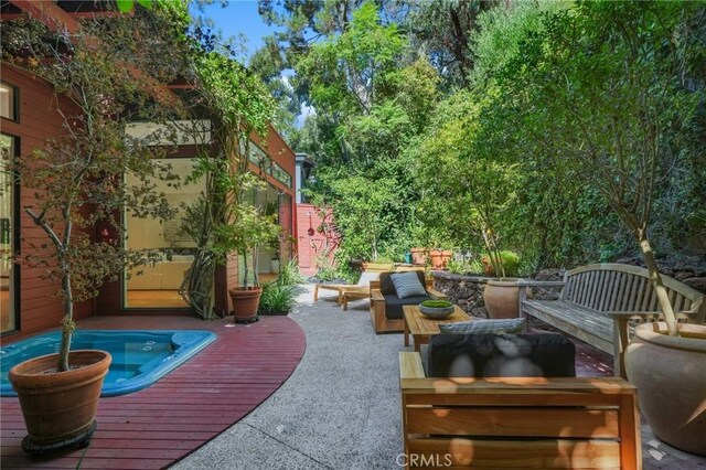 view of patio featuring a deck and an outdoor hangout area