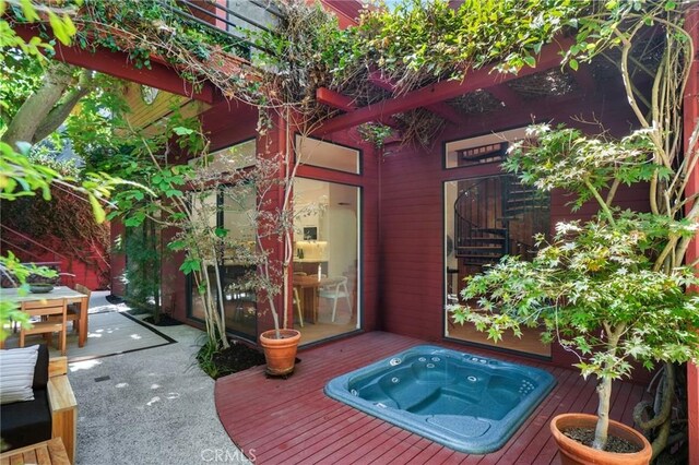 doorway to property featuring a wooden deck