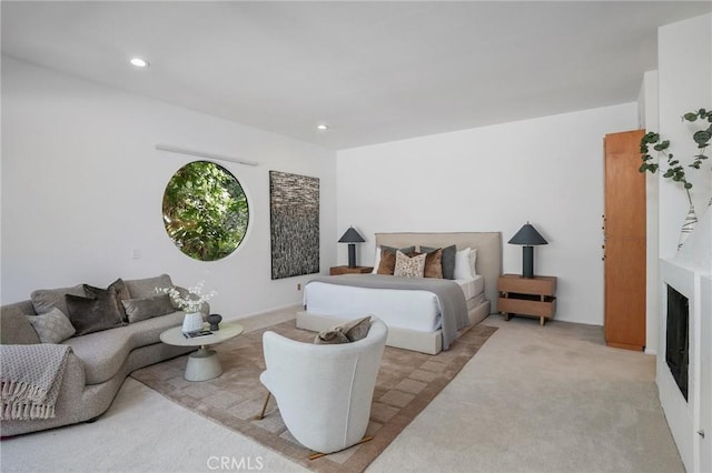 carpeted bedroom featuring a fireplace and recessed lighting