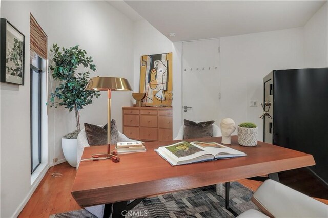 office featuring light hardwood / wood-style floors and plenty of natural light