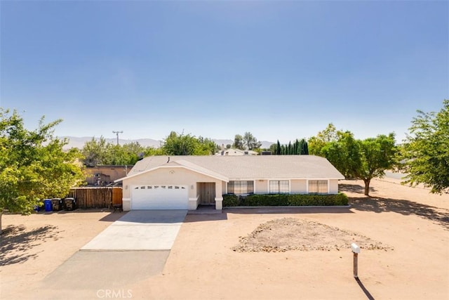 single story home featuring a garage