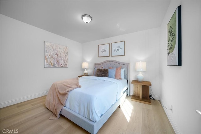 bedroom with light wood-type flooring