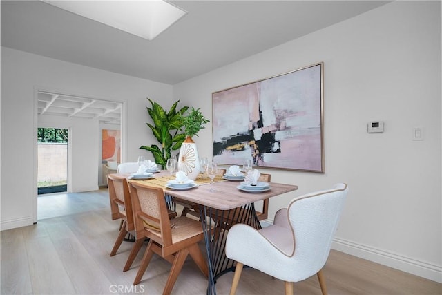 dining room with light wood-type flooring