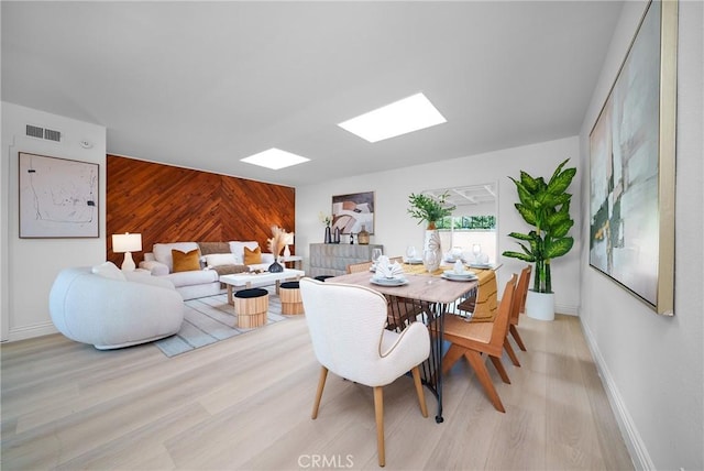 dining space featuring light hardwood / wood-style floors