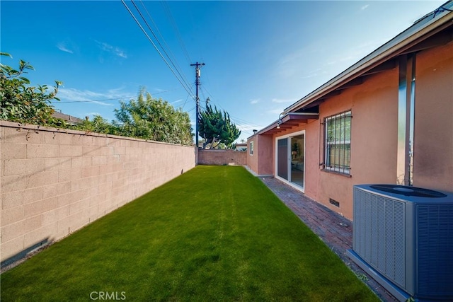 view of yard featuring central AC