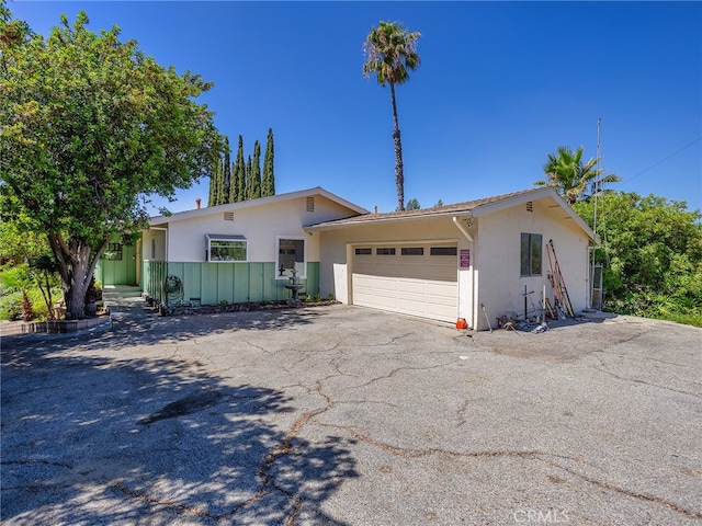 ranch-style home with a garage