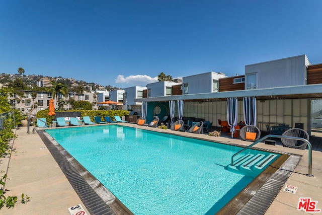 view of pool featuring a patio area