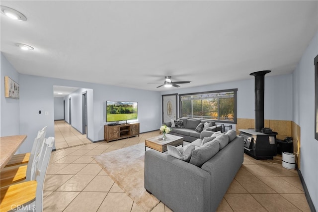 tiled living room with ceiling fan