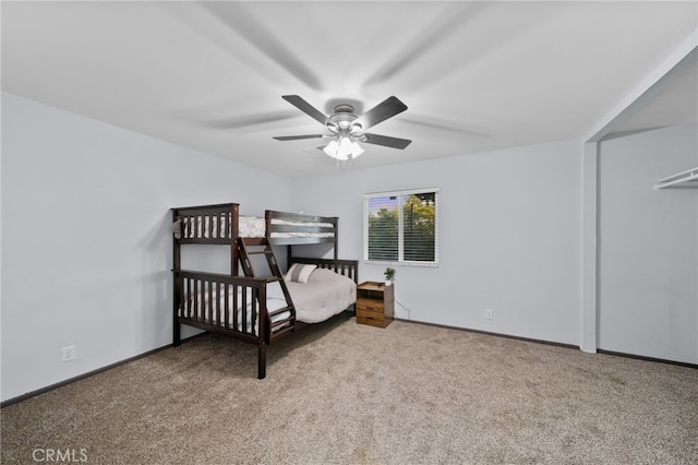 bedroom featuring light carpet and ceiling fan