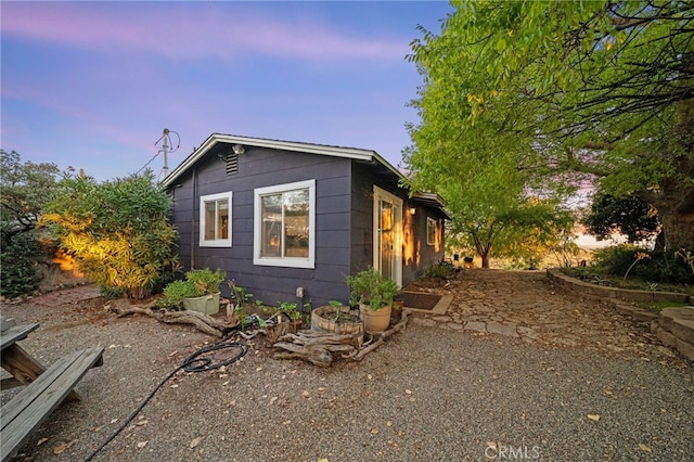 view of property exterior at dusk