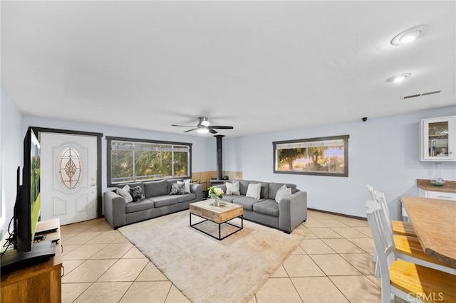 living room with ceiling fan and light tile patterned floors