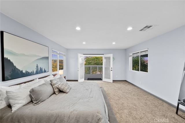 carpeted bedroom featuring access to exterior