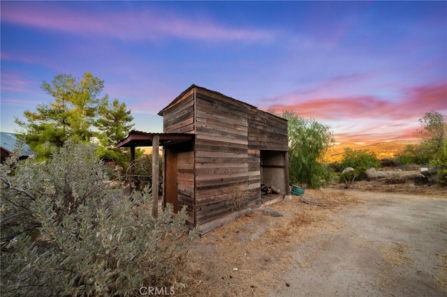 view of outdoor structure at dusk