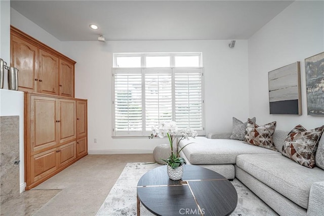 carpeted living room featuring a wealth of natural light